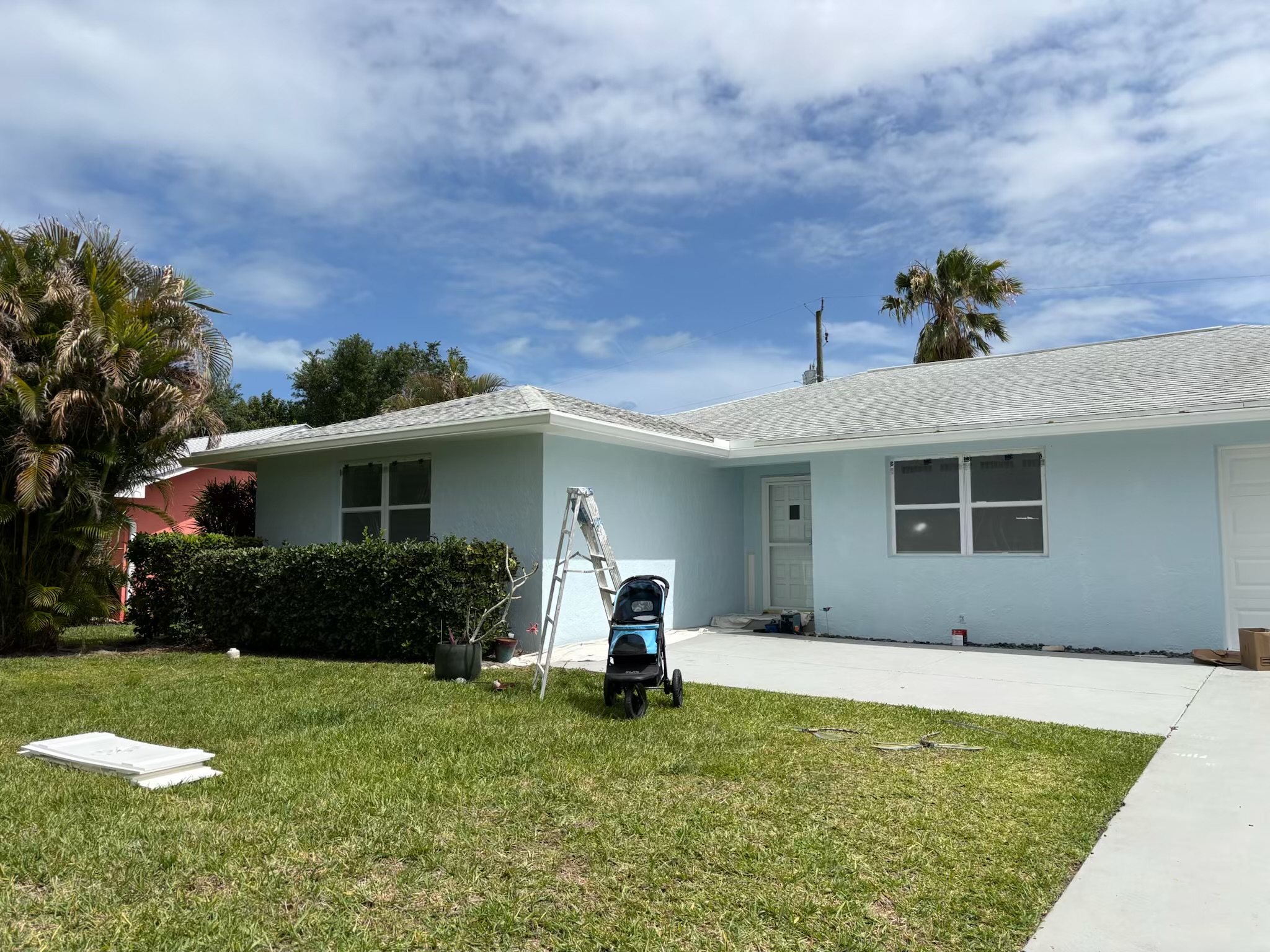 Fresh blue home front yard exterior repaint