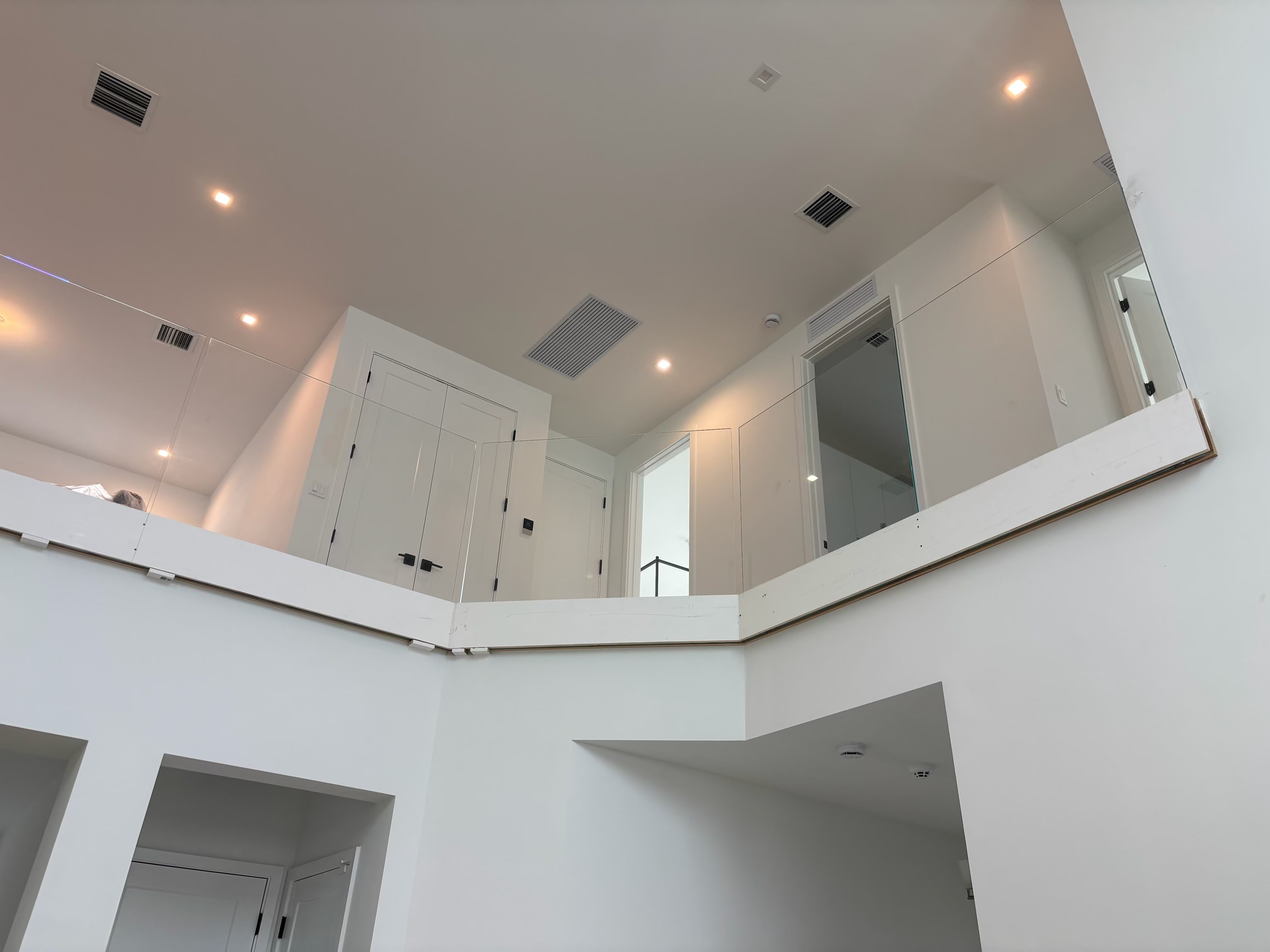 High ceiling interior with bright white painted walls